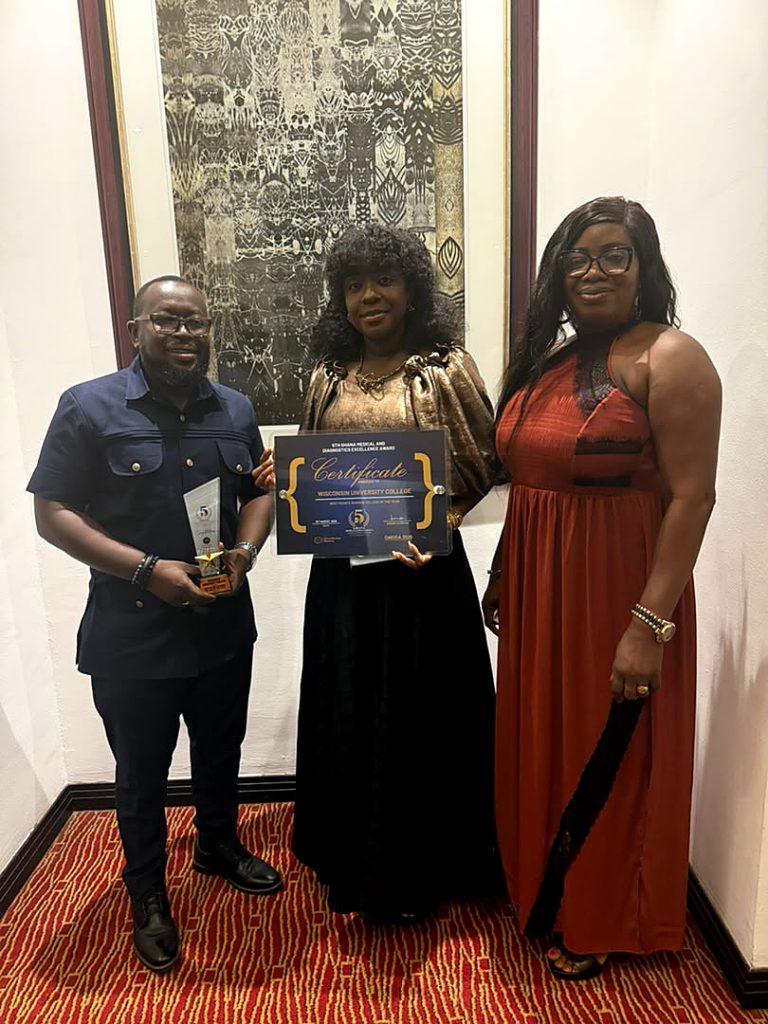 WIUC-Ghana representatives holding the Best Private Nursing College award trophy and certificate