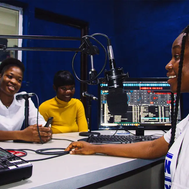 Students recording in a radio studio - diploma programmes